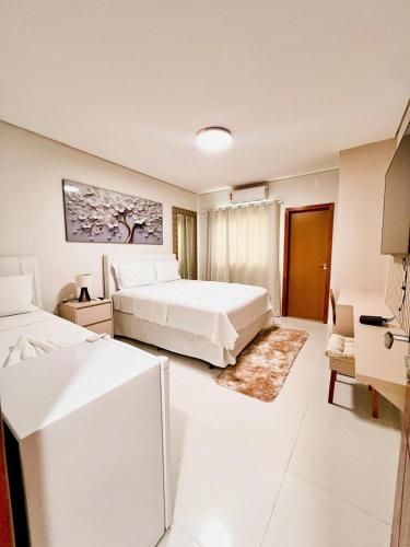 Postel nebo postele na pokoji v ubytování Hotel Glória