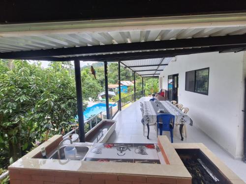 a patio with a sink and a table on a house at CASA BLANCA EN LA VEGA in La Vega