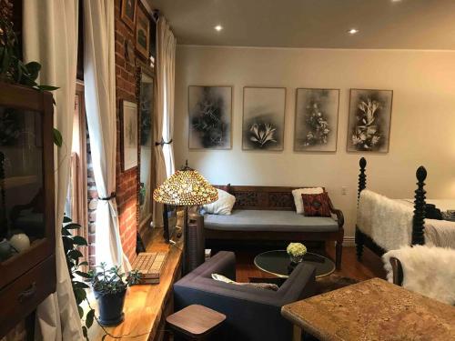 a living room with a couch and a table at Main Street Glorious Penthouse in Telluride