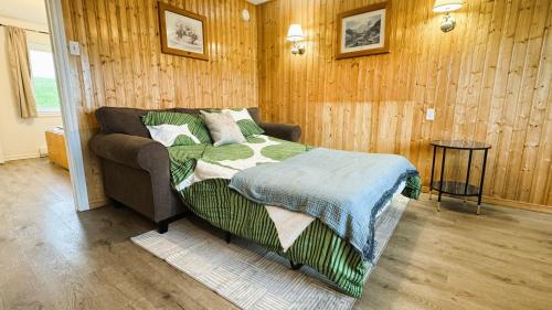 Ένα ή περισσότερα κρεβάτια σε δωμάτιο στο The Great Cabot Lodge