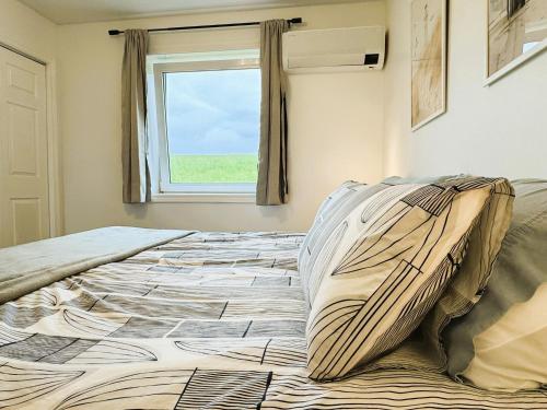 Ένα ή περισσότερα κρεβάτια σε δωμάτιο στο The Great Cabot Lodge