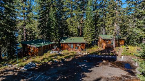 an aerial view of two cabins in the woods at Kit Carson Lodge in Kit Carson
