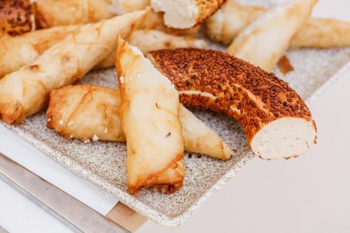 a plate of food with a piece of bread at Boii Rest & Breakfast in Siğacık
