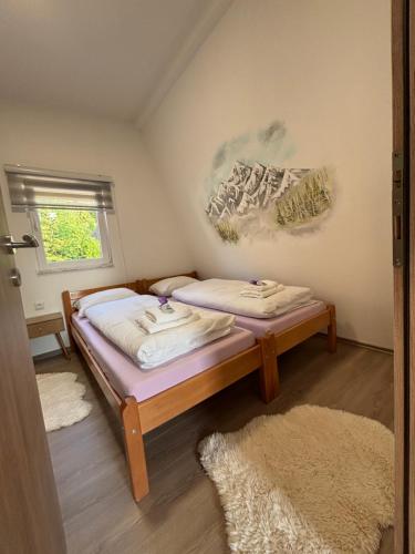 Postel nebo postele na pokoji v ubytování Apartmani Snježna Kraljica Vlašić 2