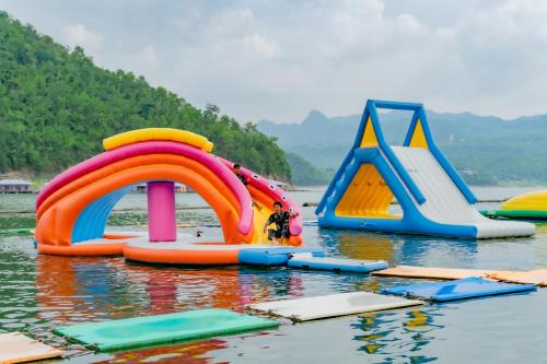 a group of inflatable slides in the water at เดอะวอเตอร์ปาร์ครีสอร์ท- The Water Park Resort in Ban Laem Mong Khoi