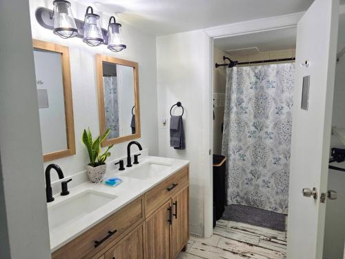 a bathroom with a sink and a shower at Fabulous Oceanfront Studio w/kitchen, tiki bar in Daytona Beach