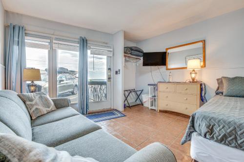 a living room with a bed and a couch at Walk to Old Orchard Pier Cozy Beachfront Condo! in Old Orchard Beach