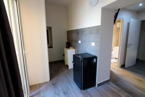 a hallway with a black trash can in a room at La Casa del Don in Capua