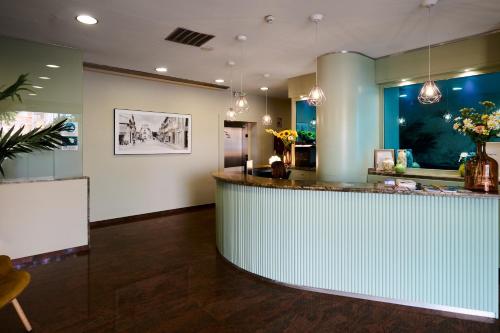 a lobby with a counter in a room at Ramblas Vendrell in El Vendrell