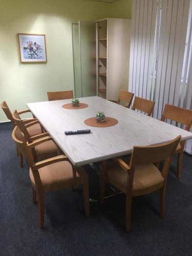 a table in an office with chairs around it at Monteur-Zimmer Winter in Castrop-Rauxel