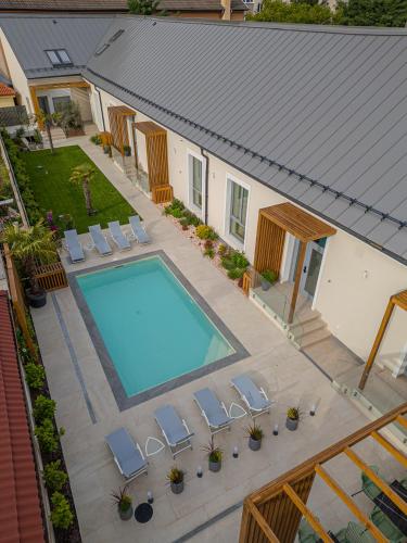 an overhead view of a swimming pool in a house at Dripper Urban Retreat in Oradea