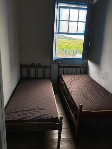 Postel nebo postele na pokoji v ubytování Linda Fazenda Centenária em Três Corações