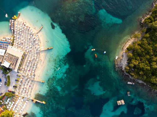 an aerial view of a beach with boats in the water at Vila Eqerem Dauti Ksamil in Ksamil