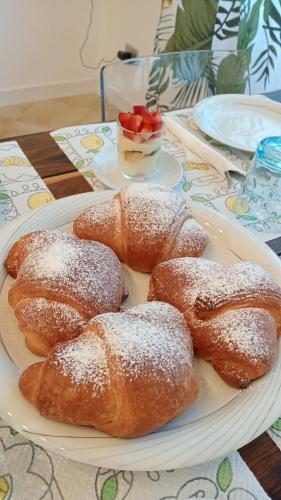 a plate with four pastries on a table at MAWA in Ferrara
