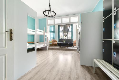 a room with a hallway with a living room at Vibe Hostel Sopot in Sopot