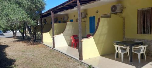 a building with some tables and chairs on it at La Mole in Peschici