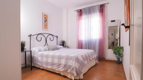 Ένα ή περισσότερα κρεβάτια σε δωμάτιο στο La Quisquilla X 50 mts de la playa