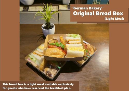 a sandwich on a tray on a table at Torifito Hotel & Pod Kanazawa in Kanazawa