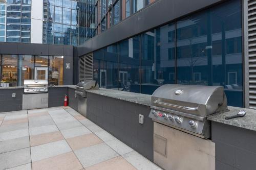 a grill on a counter in front of a building at Private Apt Downtown Seaport in Boston
