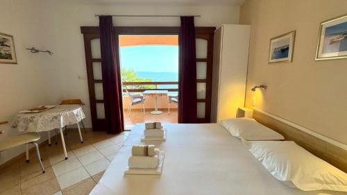 Postel nebo postele na pokoji v ubytování Apartments Bala