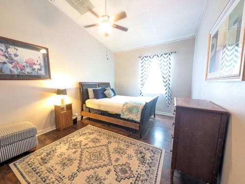 a bedroom with a bed and a ceiling fan at Chapel in Ingleside