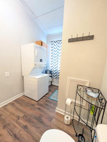 a room with a refrigerator and a microwave at Chapel in Ingleside