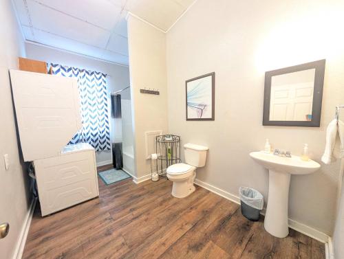 a bathroom with a toilet and a sink at Chapel in Ingleside