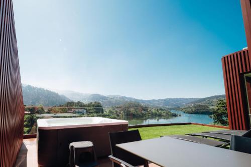 a balcony with a view of a river at Casa da Pipa in Geres