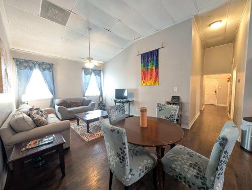 a living room with a table and a couch at Chapel in Ingleside