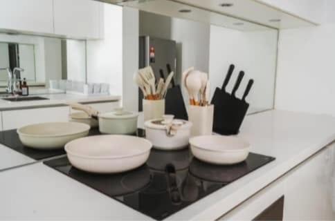 a kitchen with bowls and utensils on a counter at Vortex KLCC by Family Suites in Kuala Lumpur
