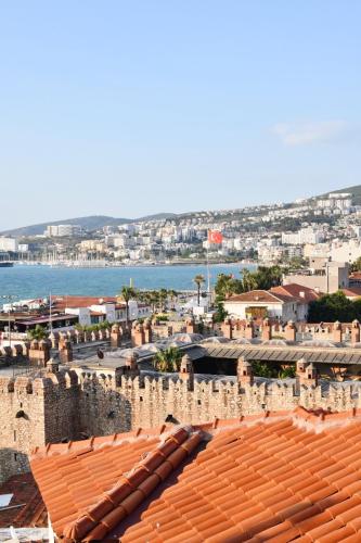 a view of a city with buildings and the ocean at Villa Ephesus Hotel in Kusadası