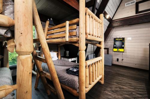 a bedroom with a bunk bed in a log cabin at Amazing Grace Where Peace Finds You in Pigeon Forge