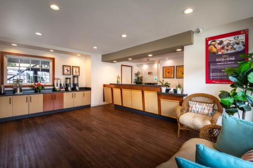 a salon with a waiting room with a counter and chairs at Alpine Inn near Convention Center and the Park in Anaheim