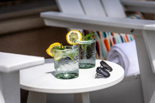 two glasses of water and lemon slices on a stool at Alpine Inn near Convention Center and the Park in Anaheim