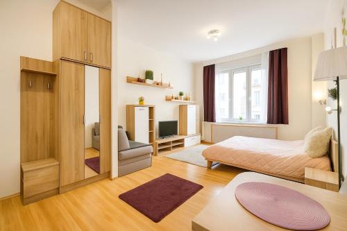 Posteľ alebo postele v izbe v ubytovaní Andy's Home Central Apatment