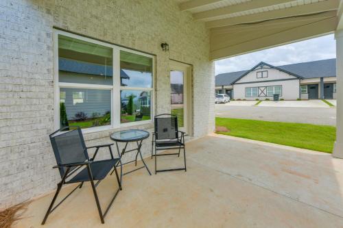 a patio with two chairs and a table at 5 Mi to Auburn University Sleek Townhome with Patio in Opelika