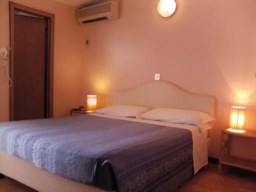 Кровать или кровати в номере Hotel Parco