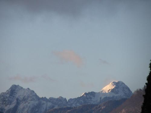 a snow covered mountain in the distance at Warmbad Apartments in Villach