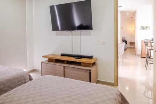 TV a/nebo společenská místnost v ubytování Apartamento Moderno y Lujoso con vista al Mar PISO19 - Cerca a la Ciudad Amurallada