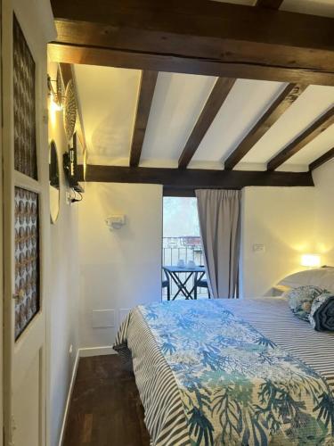 a bedroom with a bed and a view of a balcony at Lerici Charme in Lerici