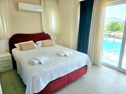 A bed or beds in a room at Villa Anemon