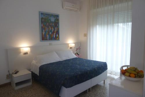 Postel nebo postele na pokoji v ubytování Hotel Astra