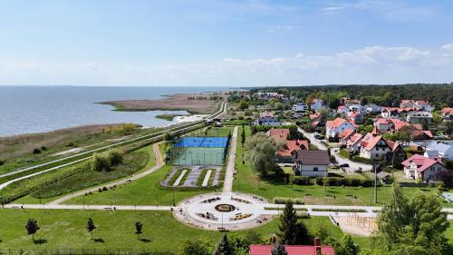 an aerial view of a small town next to the water at Pokoje gościnne Maria in Krynica Morska