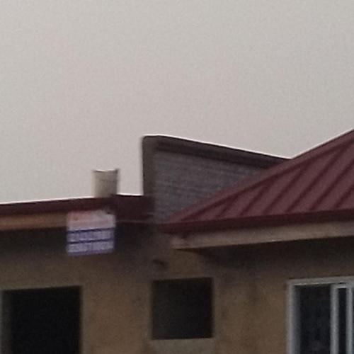 a close up of a house with a red roof at Boomville suites in Tokuse