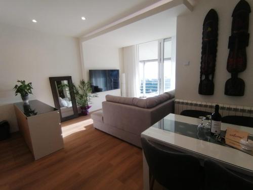 a living room with a couch and a table at Apartments Knežević in Ulcinj