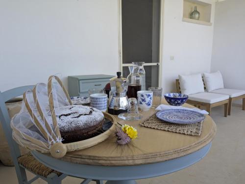 a table with a cake on top of it at Il Monile in Otranto