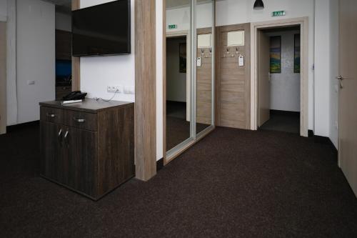an empty office with a desk and a mirror at VILSON hotel in Bukovel