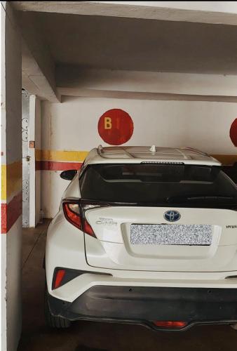 a car is parked in a parking garage at Magnifique studio cosy et lumineux avec vue sur mer in Tamaris