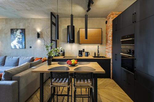 Η κουζίνα ή μικρή κουζίνα στο Loft Apartments 2 Uniejów