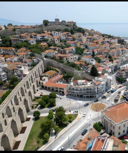 an aerial view of a city with buildings and a street at The Arch Nest in Kavala